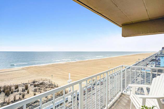 View of ocean and boardwalk from beachfront balcony
                    & more